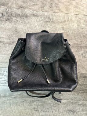 Kate Spade Black Pebbled Leather Drawstring Flap Backpack with Gold Accents
